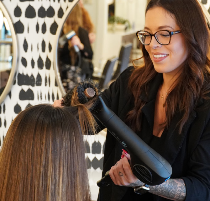 Female hair stylist with female client